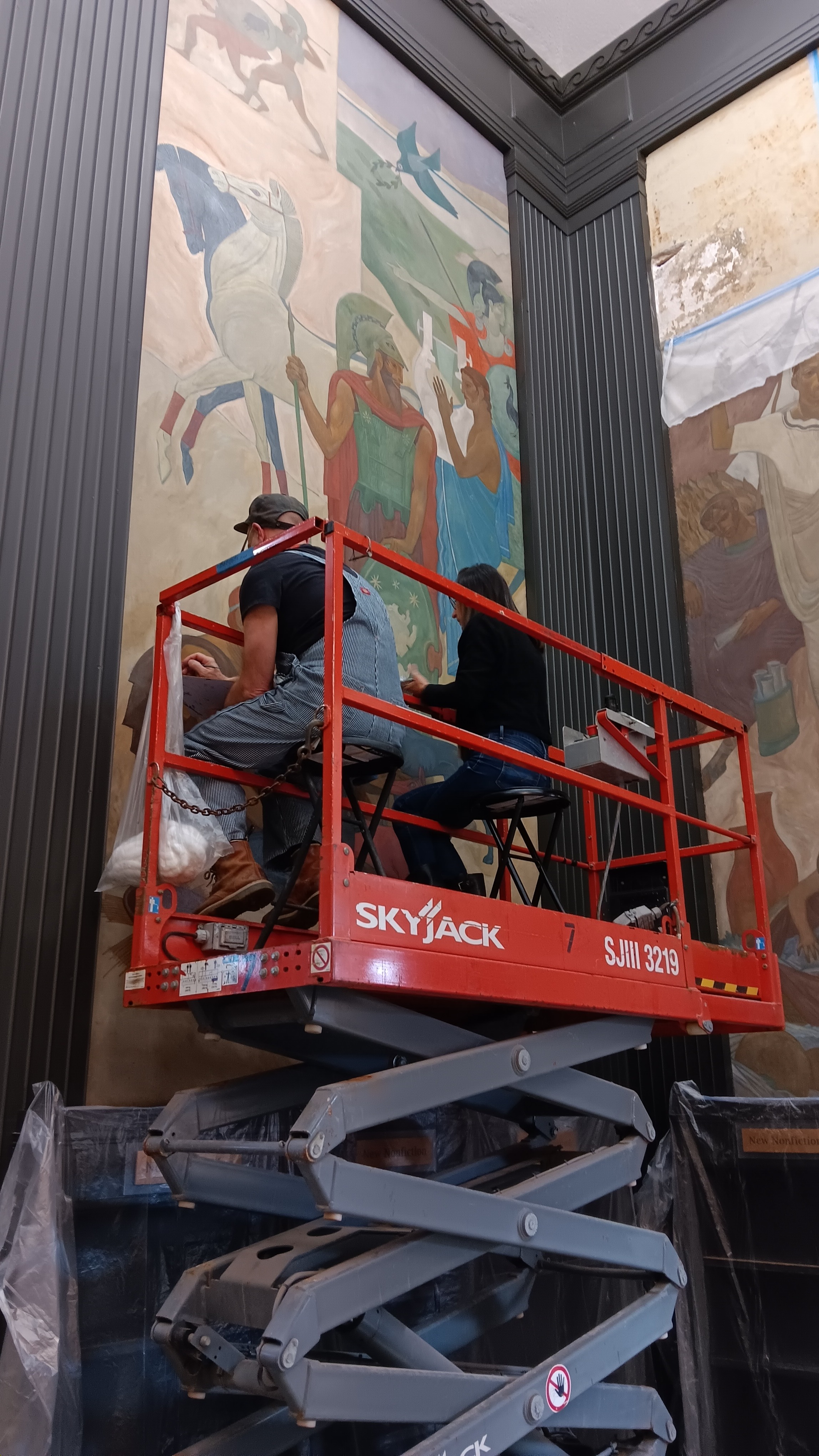 Restoration artists work on the historic 1932 murals at the Lake Forest Library that were damaged by water seepage from the dome. (Photo by Gregory Harutunian/for Chronicle Media)